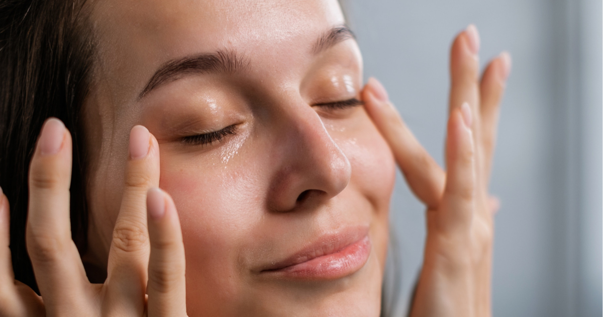 Woman applying eye cream