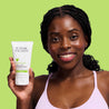 Model holding the Salicylic Acid Cleansing Wash