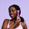 Model holding Retinol Resurfacing Concentrate