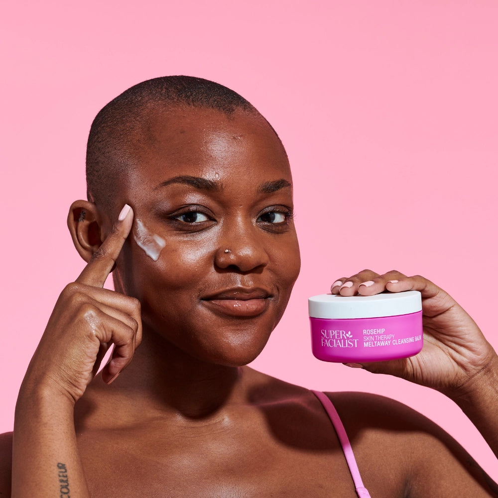 Model holding Rosehip Cleansing Balm