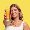 Model holding Vitamin C+ Micro Polish Wash