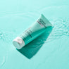 Clear Skin Clarifying Mask Light blue tube on water