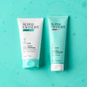 daily exfoliator and clay mask tubes on top of a blue liquid background