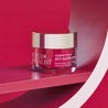 night cream jar inside a circular prop in front of red background