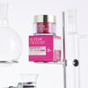 Hexapeptide night cream jar inside a lab with glass test tubes around it