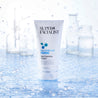 Cleanser tube with water droplets around it and lab background