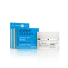 Cream jar next to blue carton packaging in front of a white background