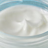 Hyaluronic acid night cream smooth texture inside the jar close up
