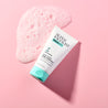 Clear Skin Exfoliator with foam texture next to it on pink background