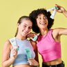 Two teen models holding Daily Moisturiser, mask, serum, spot gel and facial wash