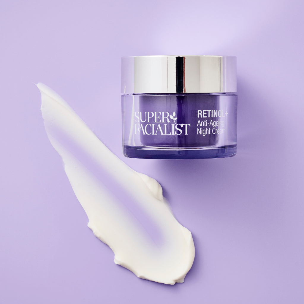 Night cream jar next to creamy swatch on purple background