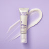 Retinol serum tube on top of creamy serum swatch