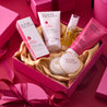Full rosehip range placed inside a pink gift box including spf15 day cream, creamy cleanser, facial oil, night cream and facial scrub