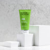 Salicylic acid facial scrub placed on top of a white cube