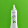 Spot gel emerging from white tube on green background