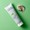 Salicylic acid clay mask tube next to a swatch of clay mask