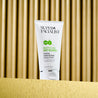 Anti blemish cleansing wash on gold table and gold background