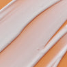 Night cream swatch close up on orange background